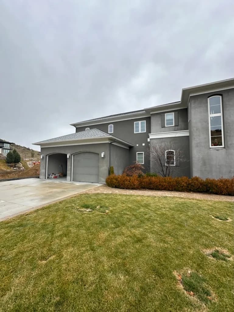 Two-story stucco residence, from Rainier Construction project photography